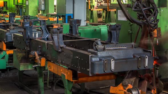 Conveyor Assembly Stage the Body of Tractor at Big Industrial Factory Timelapse