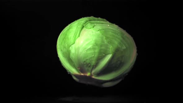 Super Slow Motion Forks Cabbage Falls on the Table with Splashes of Water