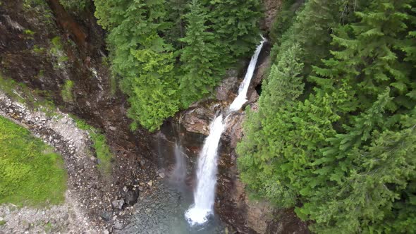 Beautiful white water cascading through dense evergreen forest, Franklin Falls, WA, aerial