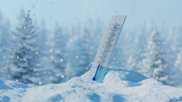 The thermometer at the snowdrift in the beautiful white snowy surrounding.Winter