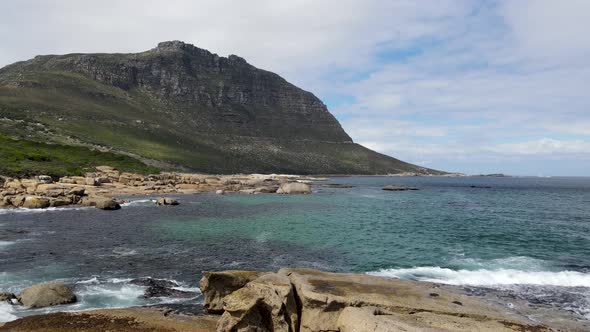 Aerial view of clear Atlantic ocean Llandudno coastline, Cape Town, South Africa.