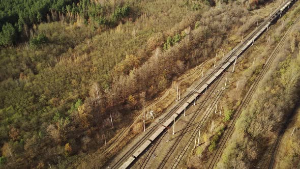 Aerial View of Freight Train Riding in Countryside