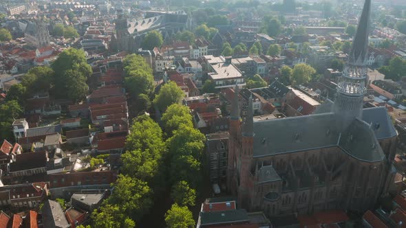 Brick Structure Of Gouwekerk Church With Residential Houses In Gouda, Netherlands. - aerial