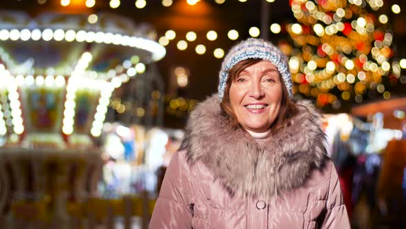 Happy Senior Woman Smiling at Christmas Market