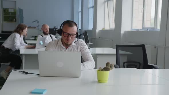 Man in White Shirt Smiling and Speak Online