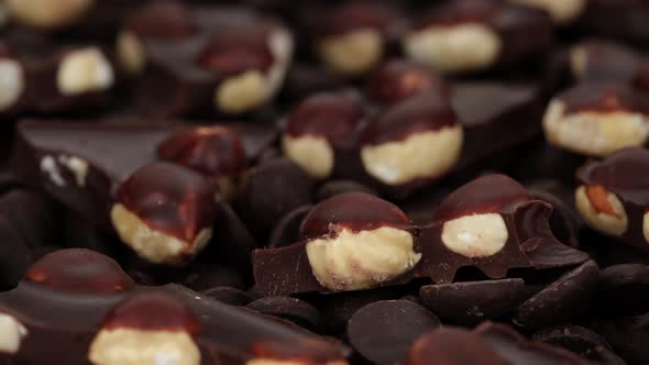 dark chocolate with nuts close up. Sliding shot. 4K UHD video