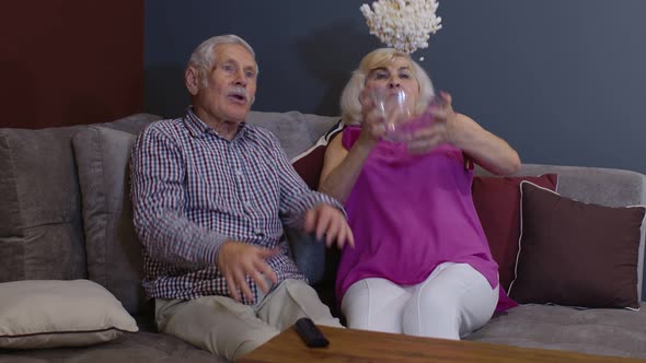 Elderly Family Suddenly Frightened and Throwing Popcorn Bowl While Watching Frightening Movie