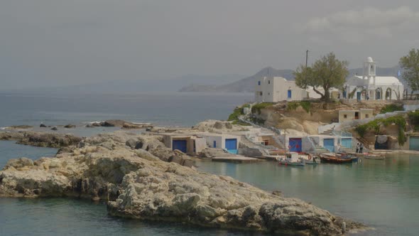 Rising Aerial Boats Docked on the Fishing Village of Mandrakia in Milos