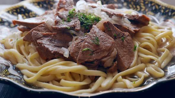 Etnic Kazakh Food  Beshbarmak Meat with Noodles