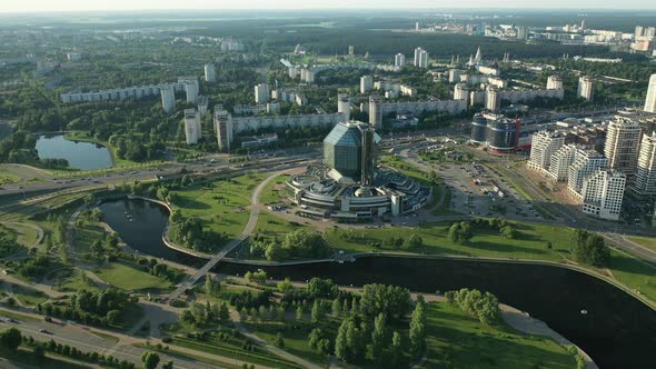 Top View of the National Library and a New Neighborhood with a Park in Minsk at Sunset