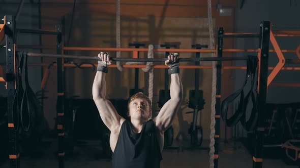 Young Man Doing Muscle Up Exercise