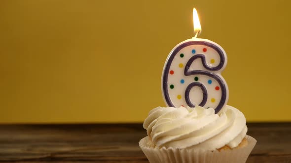 Cupcake With Number 6 Candle