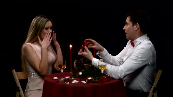 Boyfriend Requesting Hand of His Girlfriend with a Engagement Ring, Close Up