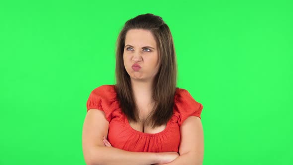 Portrait of Cute Girl Is Very Offended and Looking Away . Green Screen