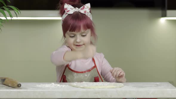 Cooking Pizza. Little Child in Apron Sprinkle the Dough with Flour in Kitchen