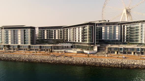 Aerial view passing by of the Ferris wheel under construction, Dubai.