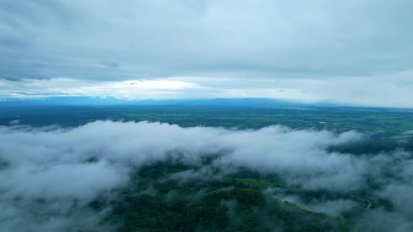 4K Aerial Drone shot flying over beautiful mountain ridge in rural jungle bush forest.