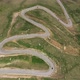 Cars passing through curve in mountain road. Mountain serpentine road - VideoHive Item for Sale