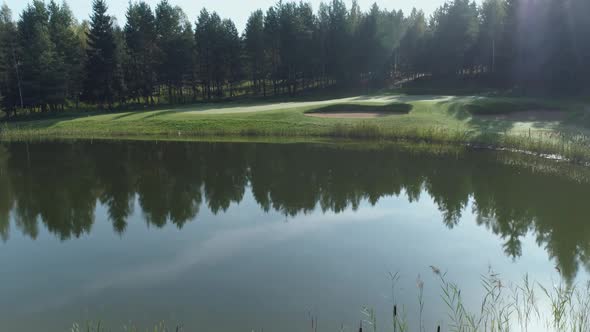 Summer Sunny Day Flying Over the Pond Aerial View of Golf Course in Forest Area Golf Club View of