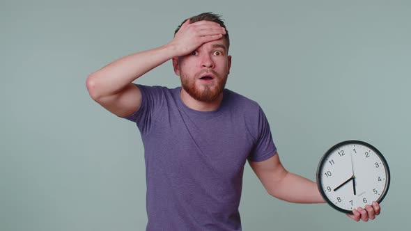 Confused Man with Anxiety Checking Time on Clock Running Late to Work Being in Delay Deadline