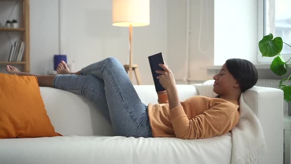 Mixed Race Woman Read Book with Smile and Turn Page Spbd