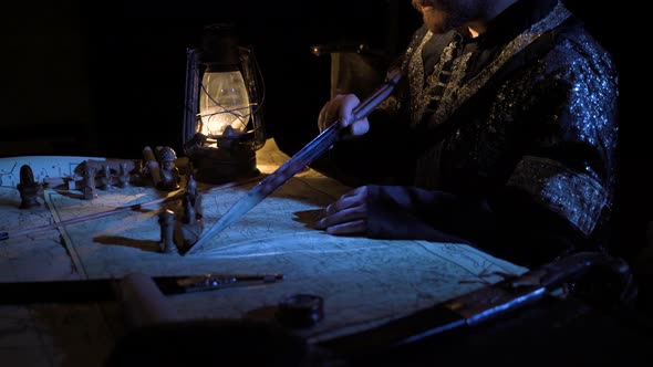 Making a battle plan by kerosene lamp.