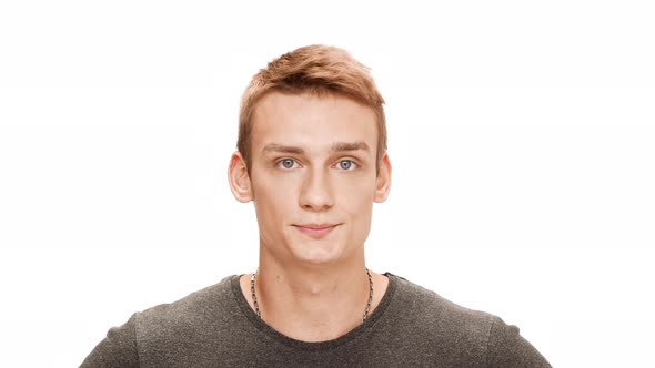 Displeased Young Handsome Man Thinking Over White Background