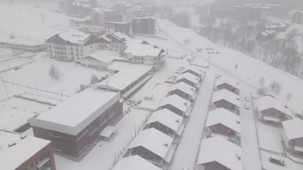 Flying over mountain resort Crystal in Bakuriani, Snowy winter day., Georgia