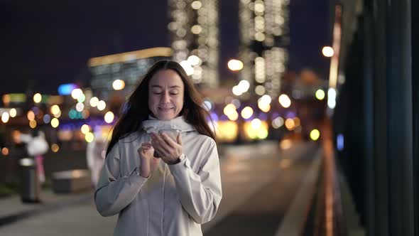 Smartphone User on City Street in Night Time Portrait of Internet Addicted Person