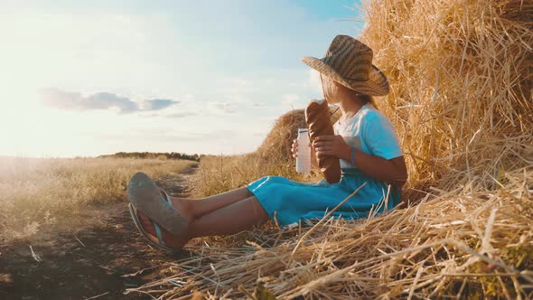 Hungry Child Eating Bread in Wheat Field, Summer Outdoor Lifestyle.