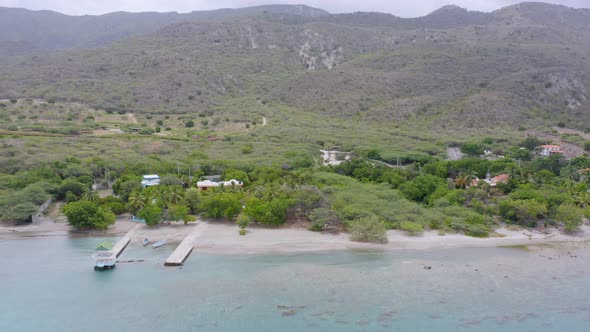 Shoreline and coastline of Bahia de Ocoa Bay in Dominican Republic. Aerial drone sideways view