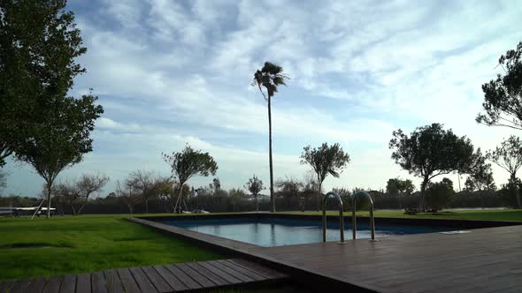 Outdoor Swimming Pool in the Windy Weather 4K