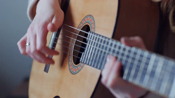 Closeup Of Singing Woman With Guitar