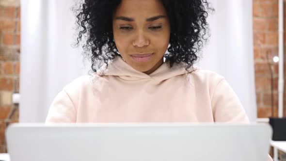 Okay Gesture By Young AfroAmerican Woman at Work