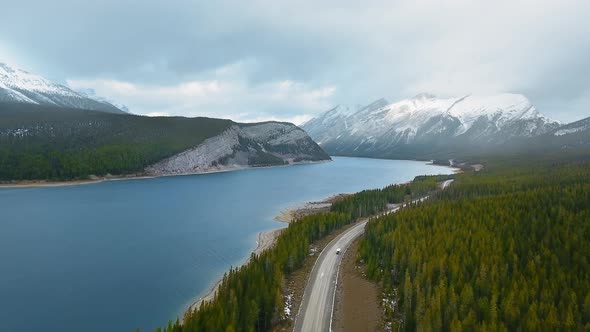 Aerial footage of the forest road running near Spray Lakes Reservoir in Alberta, Canada