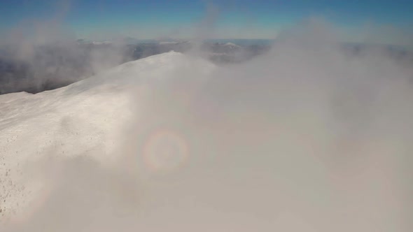 Beautiful Winter Aerial Flight Over Mountain