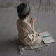 Little boy in prayer hat and arabic clothes with rosary beads and Koran book praying to God - VideoHive Item for Sale