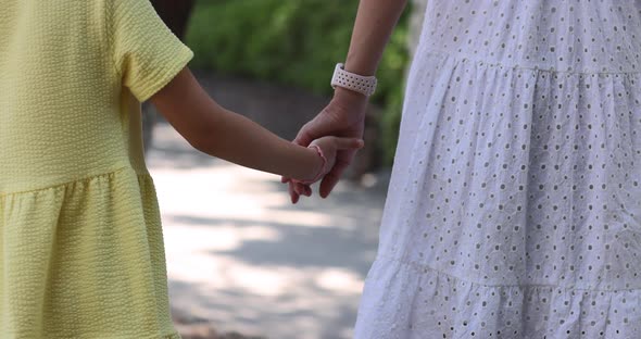 Happy Family Walking in Summer Park