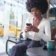Happy African American Woman Sitting in Cafe with Coffee Using Smart Phone Typing Scrolling Outside - VideoHive Item for Sale
