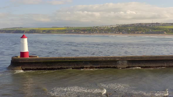 Berwick Breakwater and a Lighthouse in the Summer