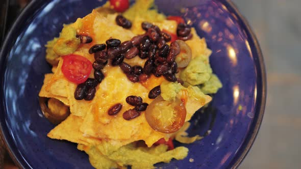 Closeup of Plate Full of Nachos Mexican Food