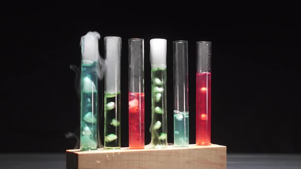 Glass Test Tubes with Boiling Multicolored Liquid