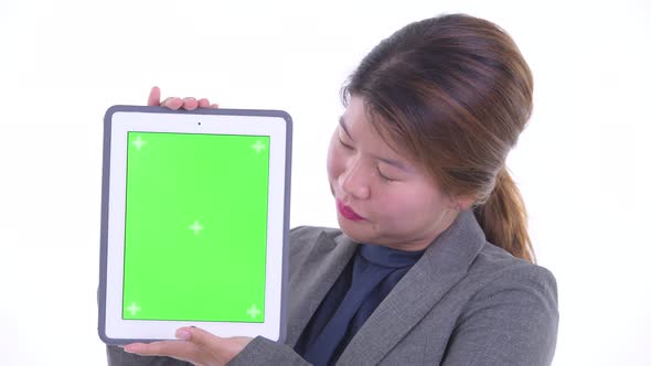 Face of Happy Young Asian Businesswoman Showing Digital Tablet