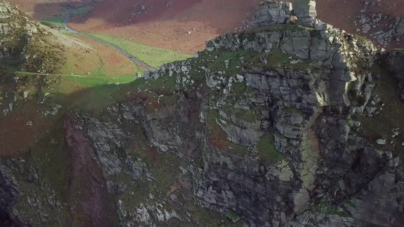 Stunning View Of The Valley Of The Rocks At The Coast In Lynton, England - aerial drone, tilt down s