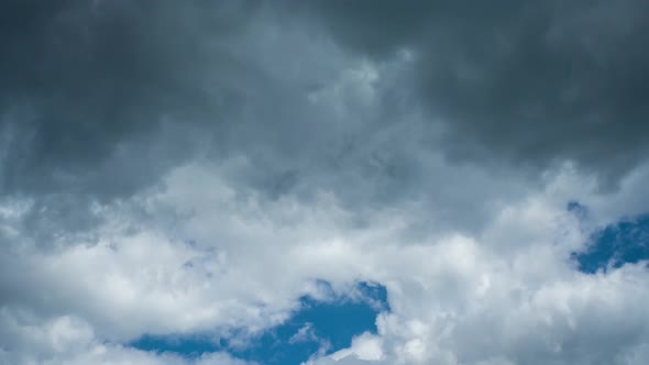 A Timelapse of the Blue Sky is Covered By White and Then Gray Clouds