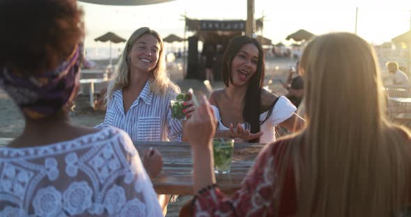 Multiracial girls having fun dancing together outdoor at beach party