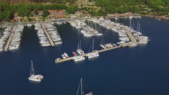 Yachts docked on pier in yacht club in marine bay