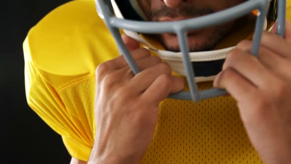 American football player with a head gear 4k