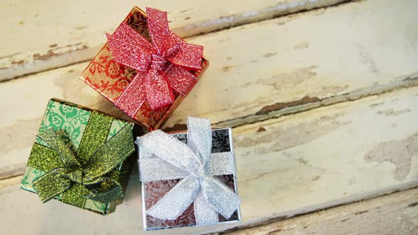 Wrapped gifts on wooden plank