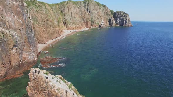 View From a Drone of the Coastline with a Rocky Coast and Hight Cliffs